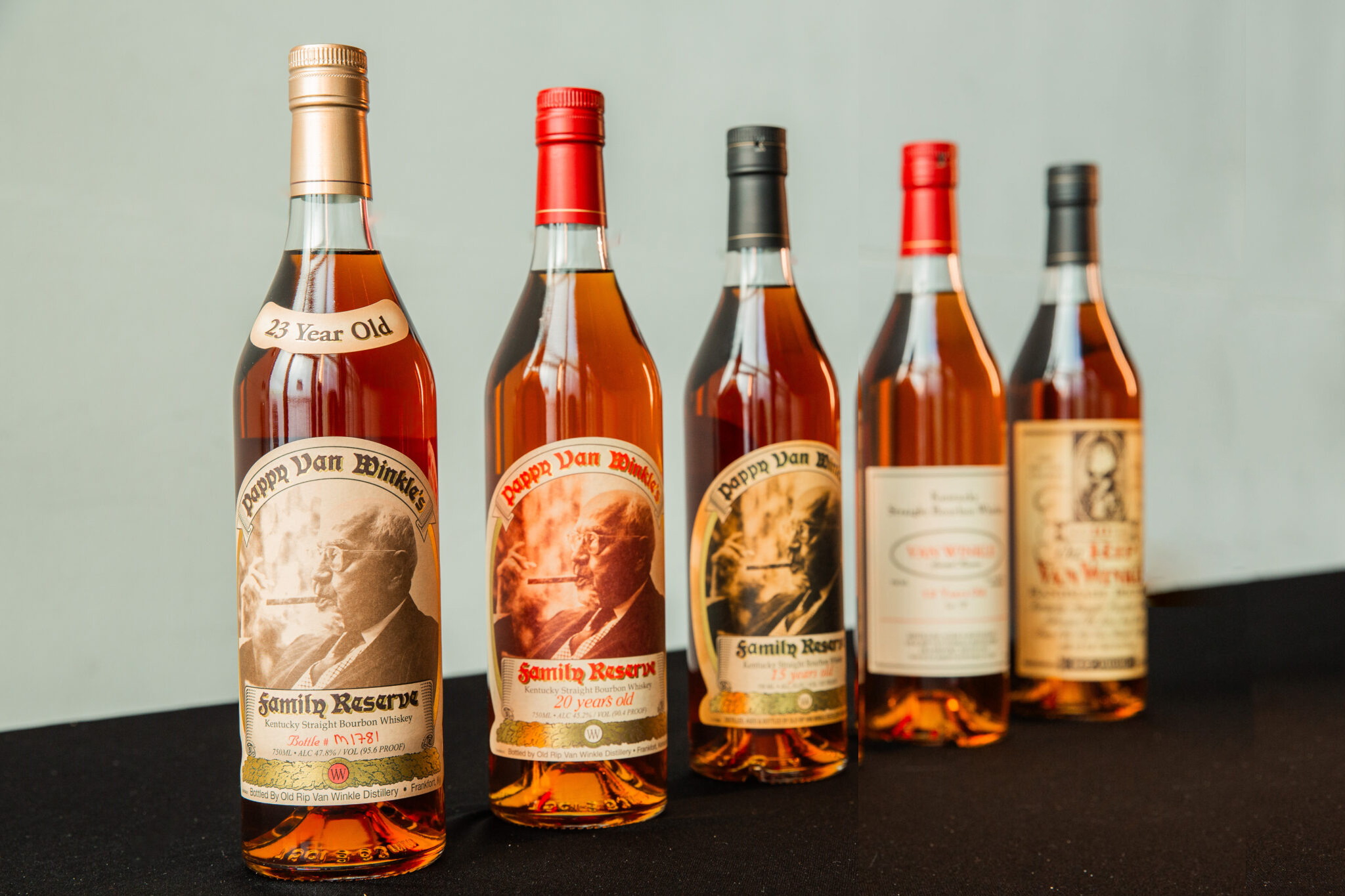 Line up of Pappy van Winkle whiskeys aged 23 20 15 12 and 10 years